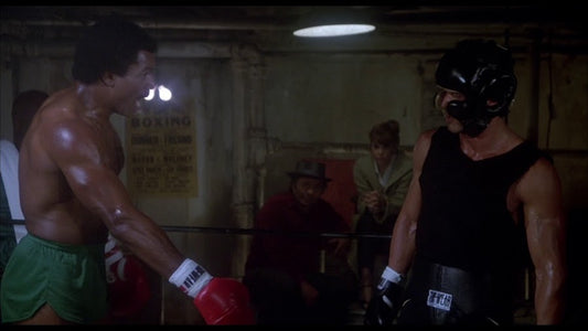 Scene from Rocky III with Apollo and Rocky sparring